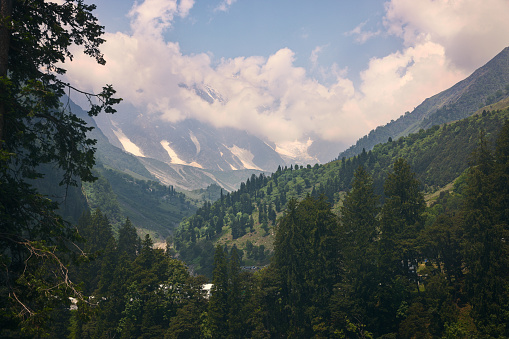 Massive Himalayan mountains with moody sky and speckled light, en route Manali to Leh, Himachal Pradesh