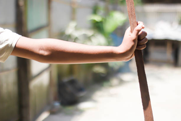 istock A man is holding wood by hand and blurred background 1829922201