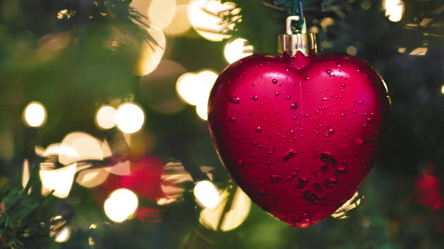 A close up shot of a Christmas decoration hanging on the Christmas tree
