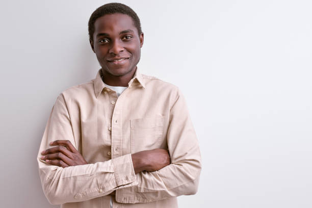 istock afro american man in casual wear smiling at camera having pleasant face 1829952229