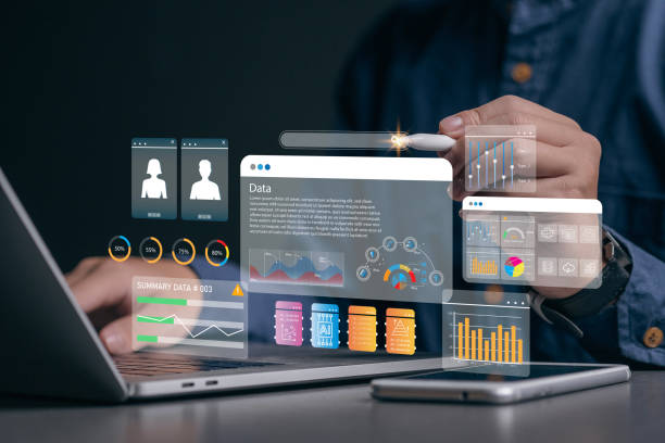 istock KPI and metrics connected to the database for technology finance, operations, sales, marketing. An analyst uses a computer and dashboard for data business analysis and Data Management System 1829970971