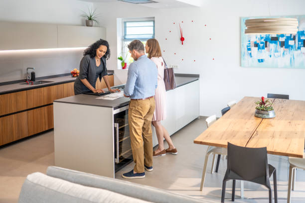 istock Couple and real estate agent checking brochure 1829978420