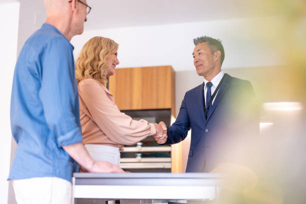 istock Couple signing house leasing agreement 1829978432
