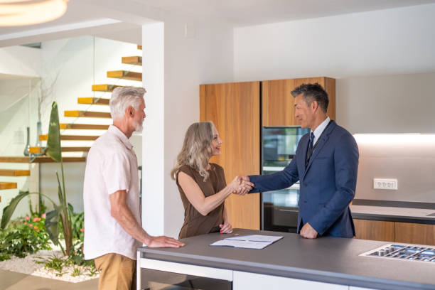 istock Couple signing house leasing agreement 1829978436
