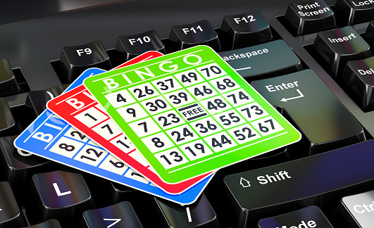 Bingo cards on computer keyboard concept, 3D rendering