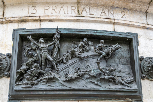 Sculpted relief, depicting events leading to the French Revolution. The artwork is located on the Plas de la Republique, in Paris, France