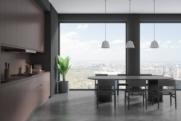 istock Brown home kitchen interior with cooking and dining room, panoramic window 1830021128