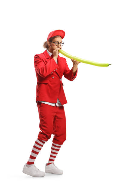 istock Entertainer blowing a long balloon 1830022178