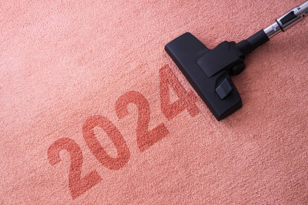 istock 2024 New year home cleaning with vacuum cleaner and copy space for a text 1830036757