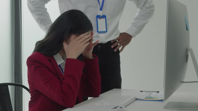 Conflict between business workers at workplace, female businesswoman is being threaten by her coworkers.
