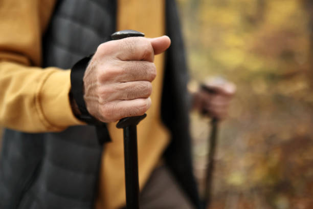 istock Active Senior Man Hiking with Hiking Poles 1830062914