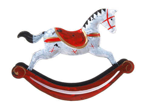 Vintage tin toy rocking horse isolated on white Background