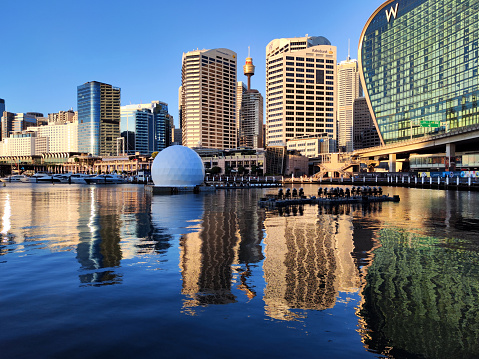 Skyline reflecting on Darling Harbour, a large recreational and pedestrian precinct that is situated on western outskirts of the Sydney central business district, New South Wales, Australia.