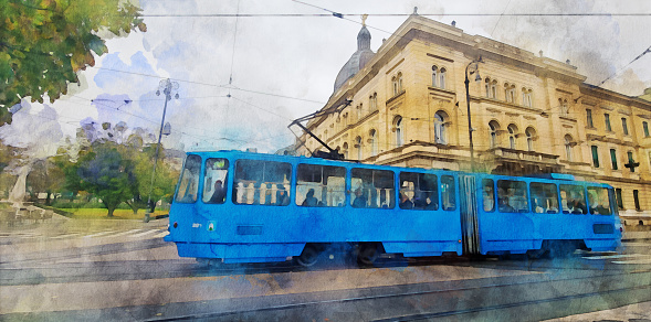 Watercolor effect on a photo of a blue modern tram (Zagrebacki elektricni tramvaj (ZET) on the street in the city center of Zagreb in Croatia with a large yellow classical building and a green park on a side. Watercolor effect on a real photo.