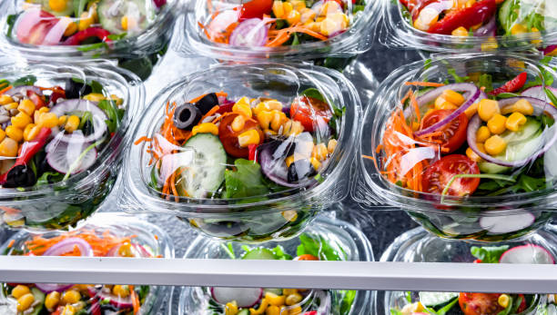 istock Boxes with pre-packaged vegetable salads in a commercial fridge 1830099172