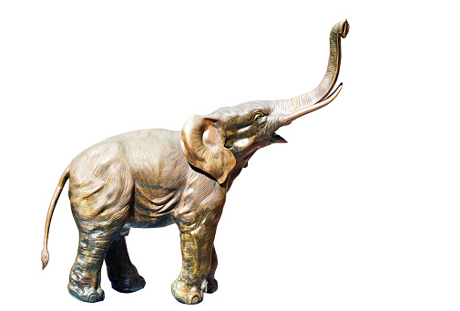 decorative elephant statue carved in bronze, ancient toy figure isolated in a white background