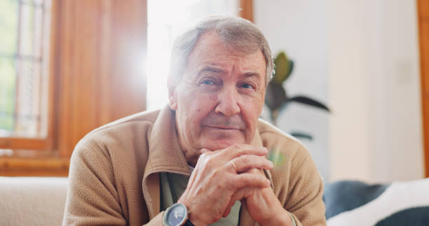 istock Thinking, reflection and senior man on sofa in living room with memory or dreaming face on walking stick. Relax, idea and elderly male person in retirement with alzheimers disease in lounge at home. 1830134130