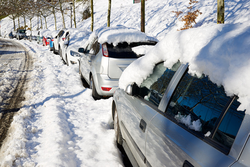 Snowy cars in Jaca, Huesca province, Pyrenees in Spain.