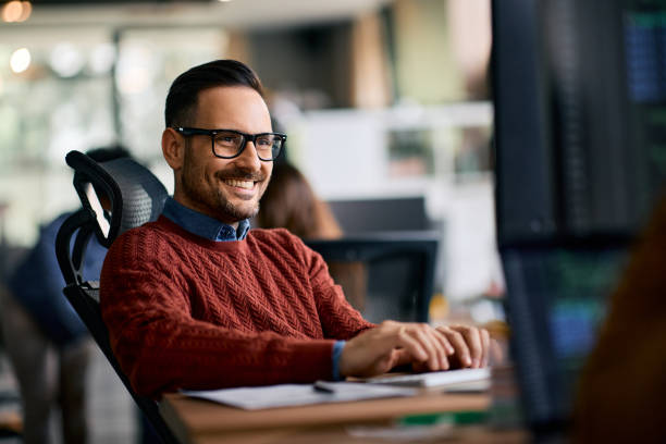 istock Happy entrepreneur working on desktop PC in the office. 1830162018