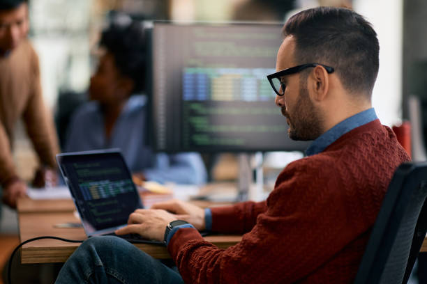 istock IT engineer working on laptop in the office. 1830163119