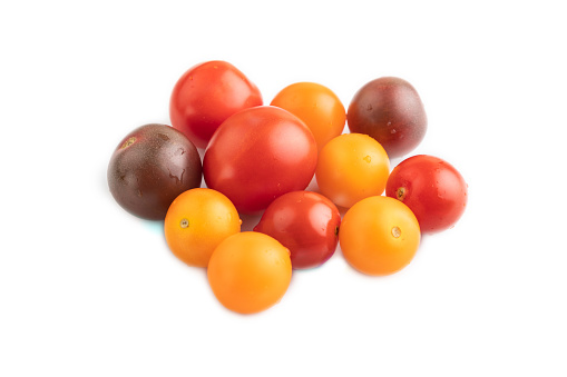 Red. yellow cherry tomatoes isolated on white background. Side view.