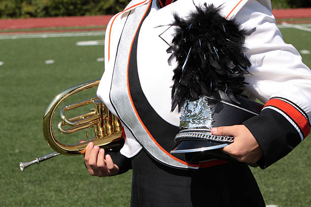 istock Marching band student holding instrument 183017303