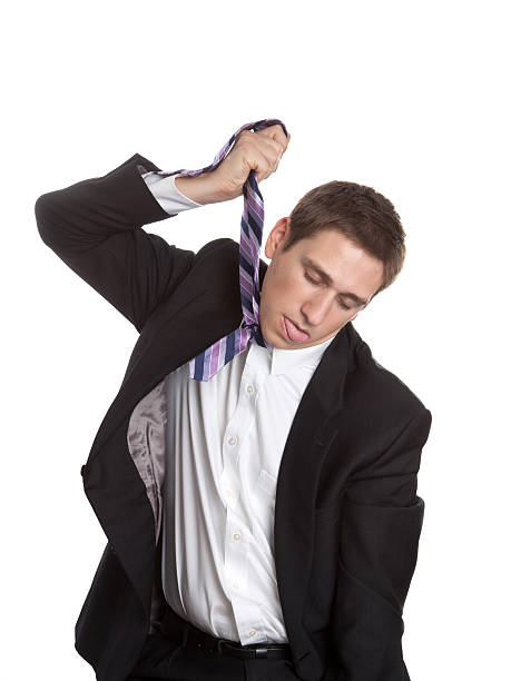 istock Man in Suit Hanging Himself with His Tie 183017356