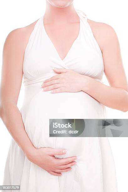 Mujer Embarazada Sosteniendo Su Vientre Foto de stock y más banco de imágenes de Blanco - Color - Blanco - Color, De ascendencia europea, Embarazada