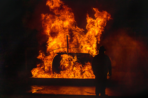 Firefighters using the high pressure hoses to extinguish the huge fire at their practice drill.