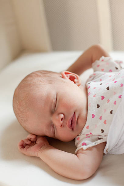 istock Sleeping Newborn Baby Girl 183018162
