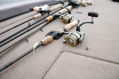 Fresh water fishing rods and reels on the deck ready to fish