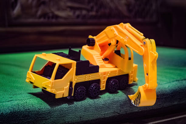 istock a yellow miniature excavator toy on the sofa 1830182129