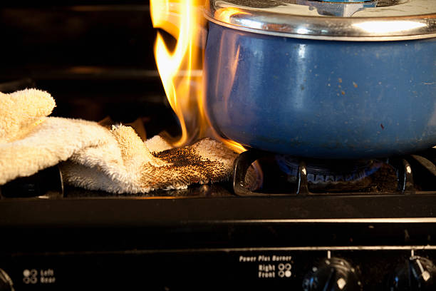 Stove Fire Series towel accidentally catches fire on stoveCheck out my Tragedy Series kitchen on fire stock pictures, royalty-free photos & images