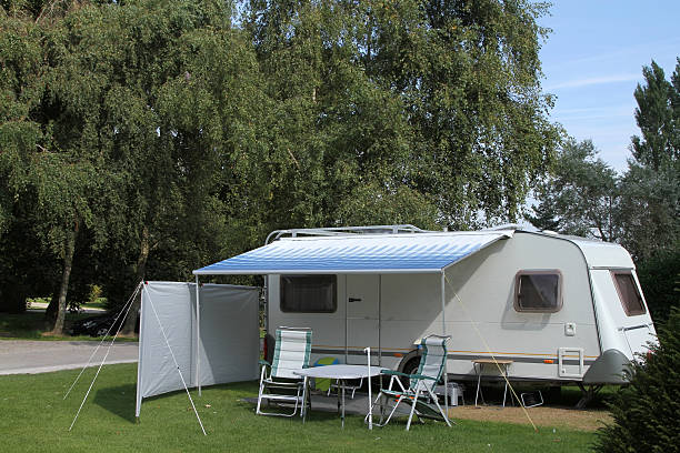 istock Camping and caravanning on a woodland caravan park 183018323