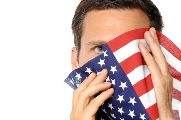 istock Man Hiding Face with US American Flag on White 183018486