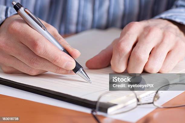 Businessman Taking Notes On Pad Stock Photo - Download Image Now - Adult, Adults Only, Author