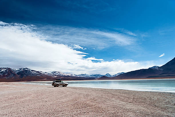 View of Laguna Blanca, Bolivian Altiplano The Altiplano (Spanish for high plain), in west-central South America, where the Andes are at their widest, is the most extensive area of high plateau on earth outside of Tibet. Lake Titicaca is its best known geographical feature. The Altiplano is an area of inland drainage (endorheism) lying in the central Andes, occupying parts of Northern Chile and Argentina, Western Bolivia and Southern Peru. Its height averages about 3,750 meters (12,300 feet), slightly less than that of Tibet. Unlike the Tibetan Plateau, however, the Altiplano is dominated by massive active volcanoes of the Central Volcanic Zone to the west like Ampato (6288 m), Tutupaca (5816 m), Nevado Sajama (6542 m), Parinacota (6348 m), Guallatiri (6071 m), Cerro Paroma (5728 m), Cerro Uturuncu (6008 m) and Licancabur (5916 m), and the Cordillera Real in the north east with Illampu (6368 m), Huayna Potosi (6088 m), Ancohuma (6427 m) and Illimani (6438 m). The Atacama Desert, one of the driest areas on the whole planet, lies to the southwest of the Altiplano. In contrast, to the east lies the humid Amazon Rainforest.http://bem.2be.pl/IS/bolivia_380.jpg amazon forest stock pictures, royalty-free photos & images