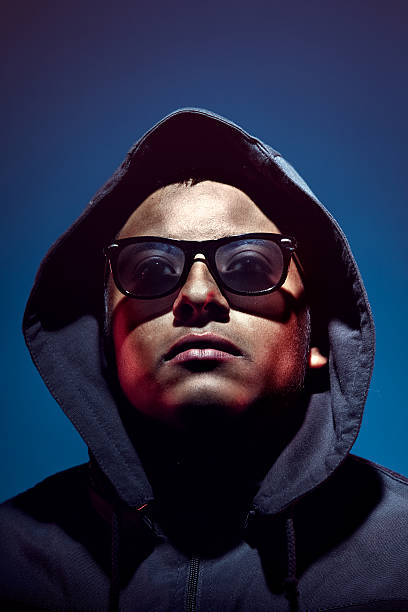 istock Dark Hooded Young Man 183019030