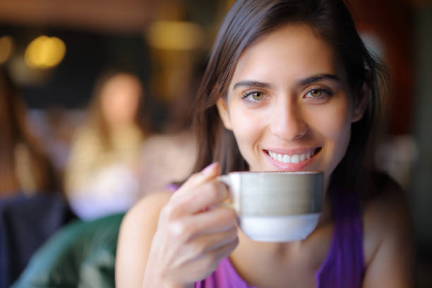 istock Happy restaurant customer looking at you with a coffee 1830191285
