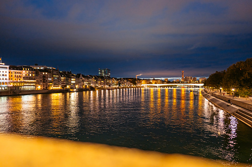 Beautiful quayside on the Rhine river in Basel in Switzerland at night.
