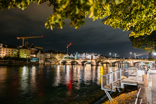 The Middle Bridge (Mittlere Brücke) on the Rhine river in Basel in Switzerland at night.