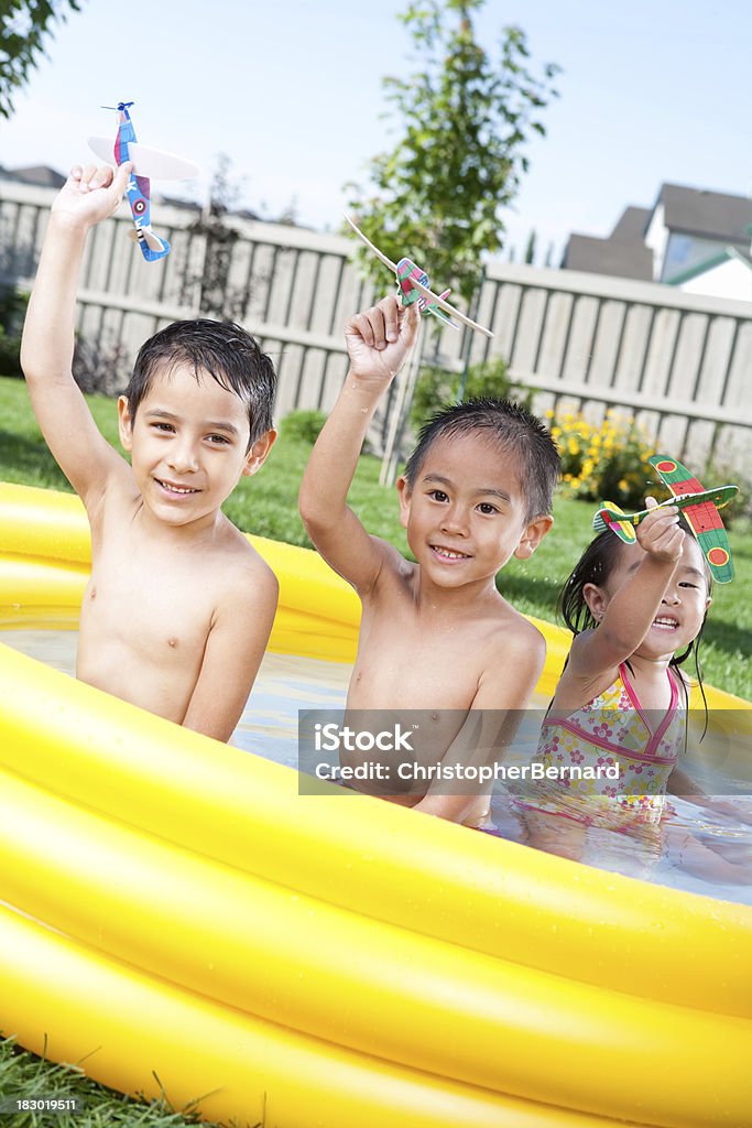 Kids swimming in wading pool Kids swimming outdoor 4-5 Years Stock Photo