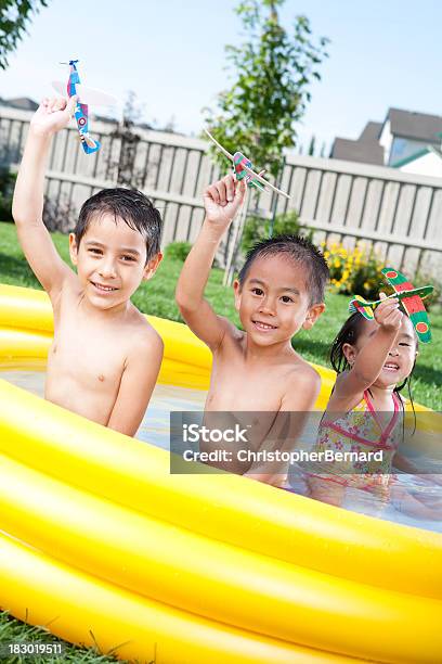 Kids Swimming In Wading Pool Stock Photo - Download Image Now - 4-5 Years, 6-7 Years, Airplane