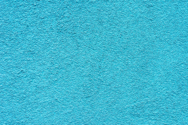 istock Grain cyan blue paint wall background or texture.Outdoor image. 1830196504