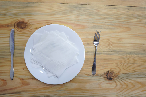 White plate on the wooden background