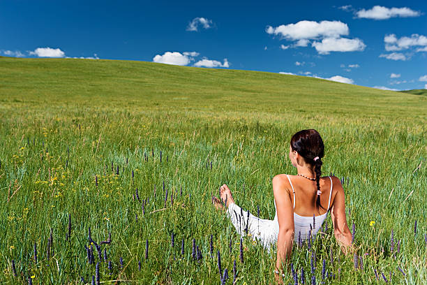 Young woman laying down on the meadow.http://bem.2be.pl/IS/nepal_380.jpg