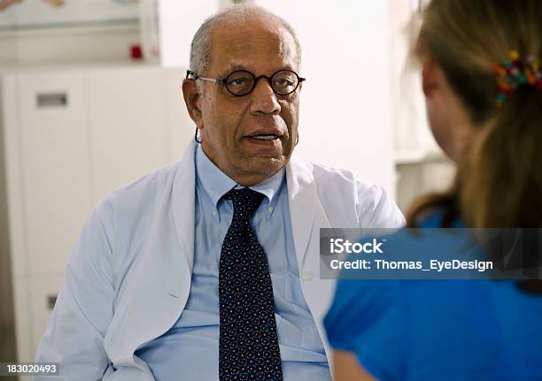 Concerned Doctor Meeting With His Patient Stock Photo - Download Image Now - Adult, Adults Only, African Ethnicity