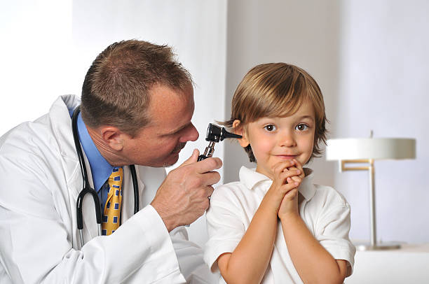 istock Nervous Young Boy with his Doctor Getting an Exam 183020696