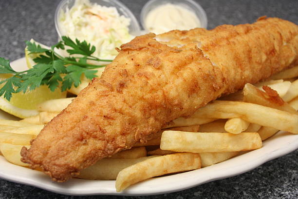 Fish & Chips "Fried haddock served with French Fries, coleslaw and tartar sauce.Please see my portfolio for many more food photos." haddock stock pictures, royalty-free photos & images