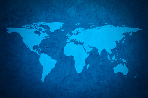 Blue world map on textured grungy background. Map traced from NASA archive public resource.